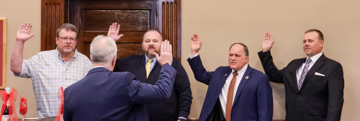 Shaun Thornley, Chad Montgomery, Tyler Vincent and Kory Wilde being sworn in by Judge Kevin Christensen